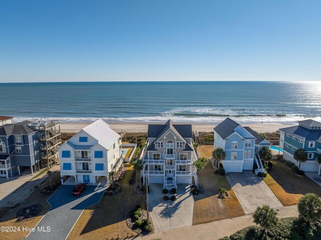 drone / aerial view featuring a view of the beach and a water view