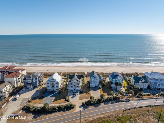 aerial view featuring a view of the beach and a water view