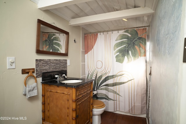 bathroom with toilet, beam ceiling, a shower with curtain, wood finished floors, and vanity