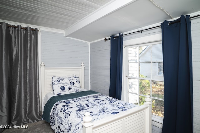 bedroom with beam ceiling