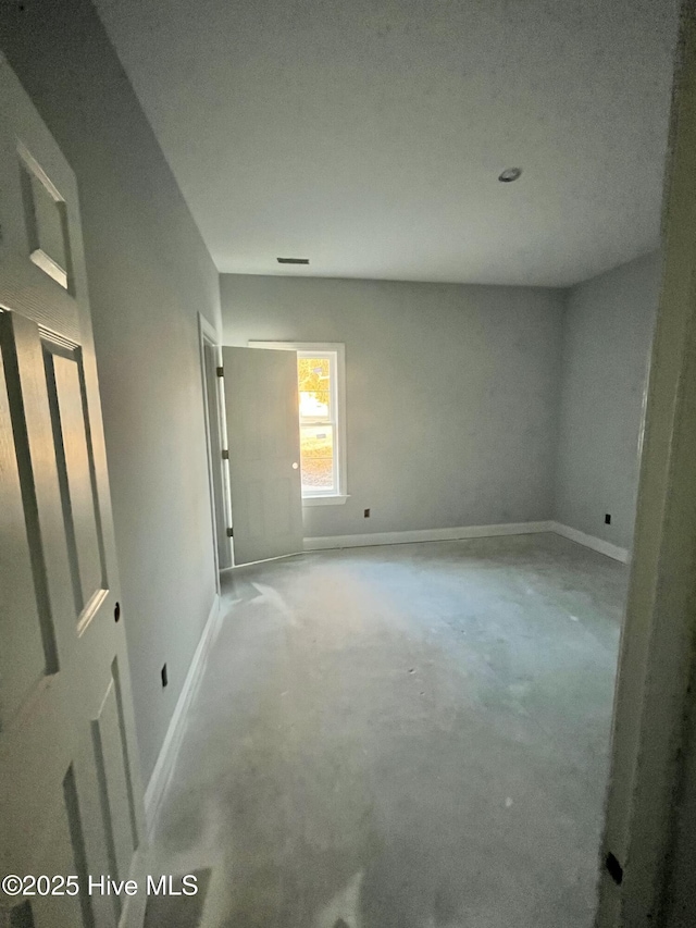 interior space featuring baseboards