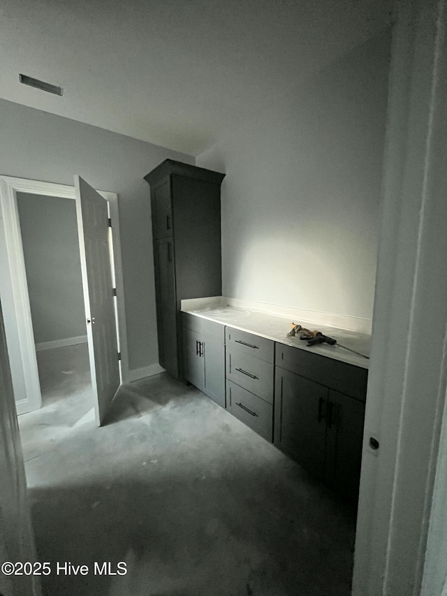 bathroom with concrete flooring