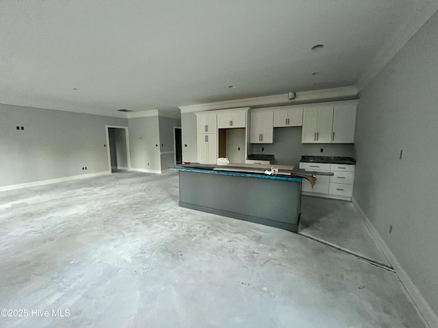 kitchen with ornamental molding and white cabinets