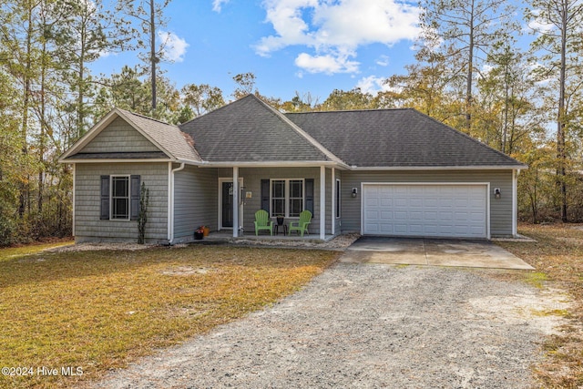 view of front facade with a porch and a garage