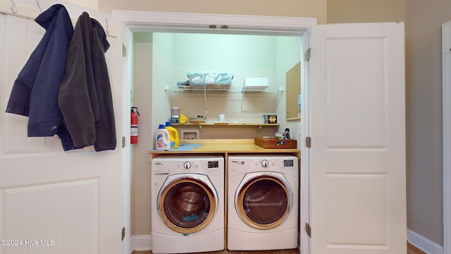 laundry area with washing machine and dryer