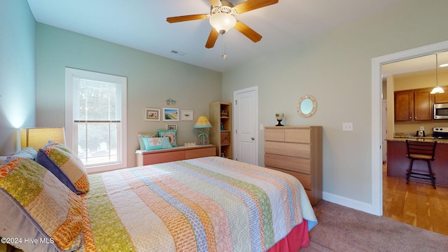 bedroom featuring hardwood / wood-style flooring and ceiling fan