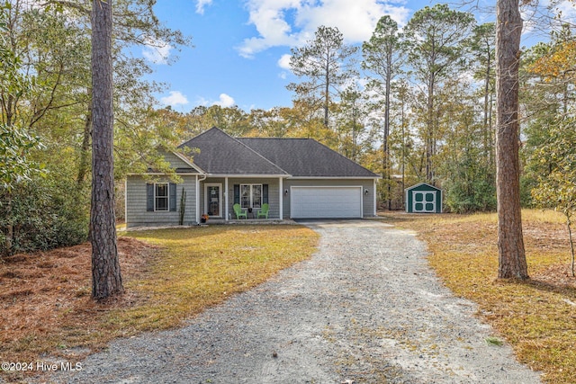 ranch-style home featuring a porch and a storage unit