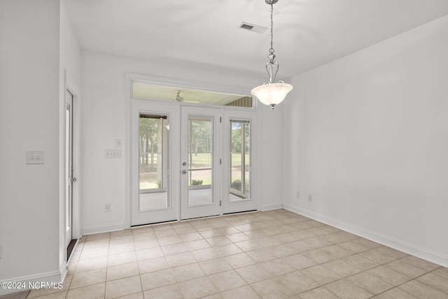 unfurnished room featuring ceiling fan and light tile patterned floors