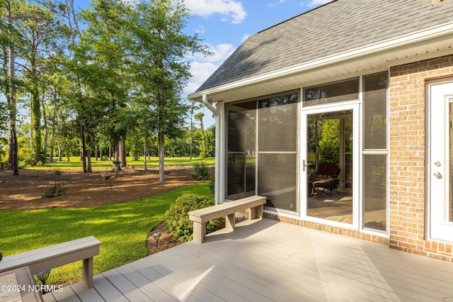 deck with a sunroom