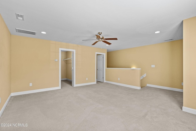 carpeted empty room with ceiling fan