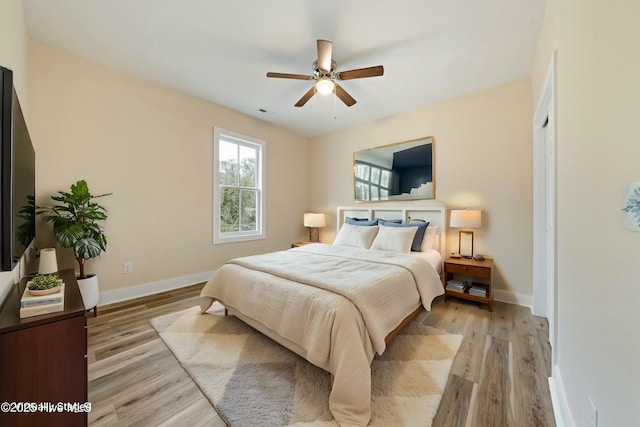 bedroom featuring light hardwood / wood-style flooring and ceiling fan