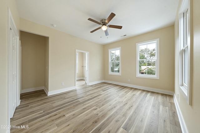 spare room featuring ceiling fan and light hardwood / wood-style flooring