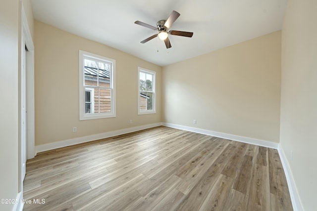 unfurnished bedroom with ceiling fan and light wood-type flooring