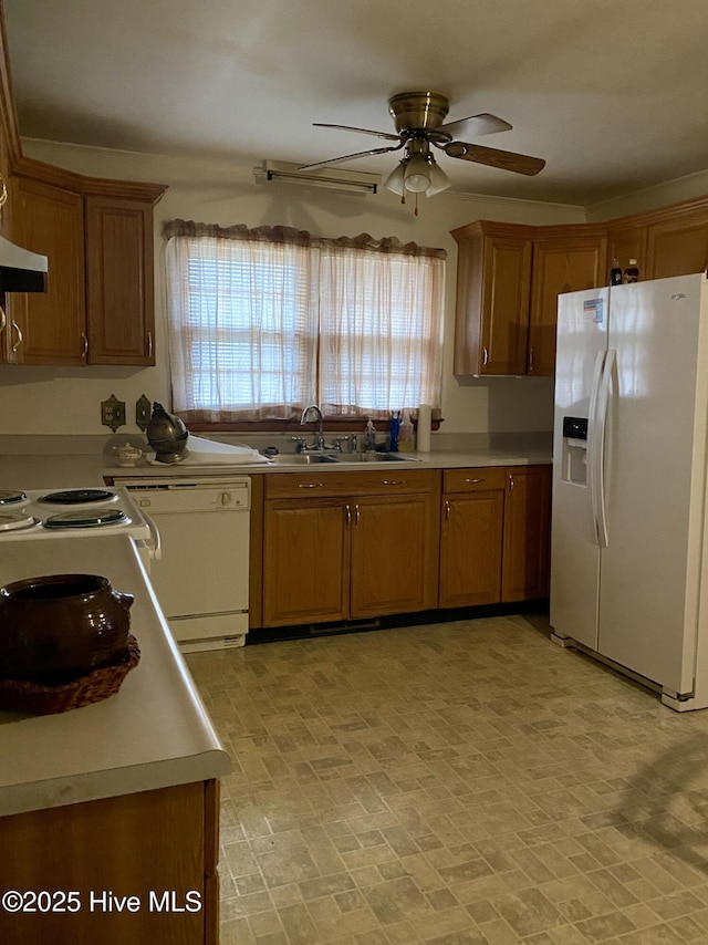 kitchen featuring ceiling fan, white appliances, and sink