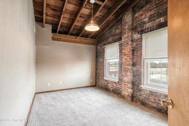 spare room featuring carpet floors, brick wall, vaulted ceiling with beams, and wood ceiling