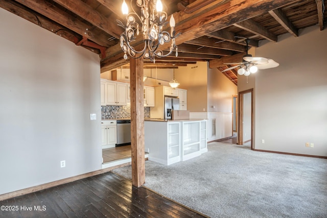 unfurnished living room with ceiling fan, dark hardwood / wood-style flooring, lofted ceiling with beams, and wooden ceiling