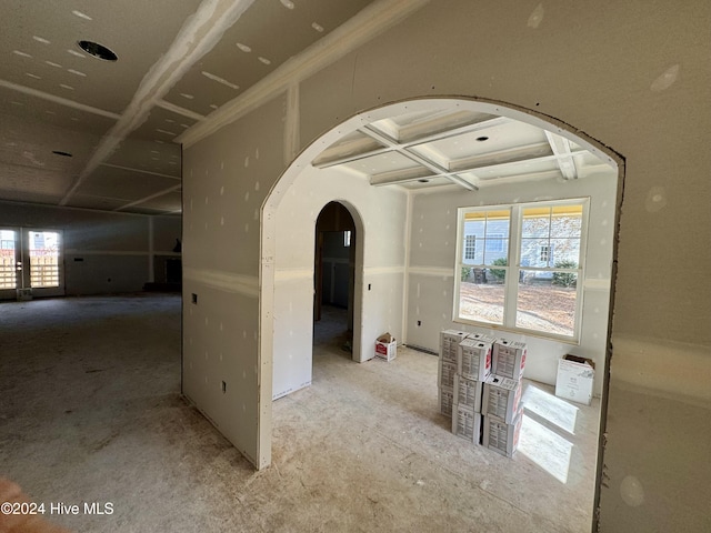 hallway featuring beamed ceiling and coffered ceiling