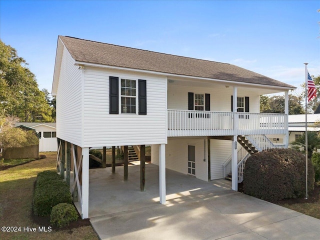 coastal home with a carport and covered porch