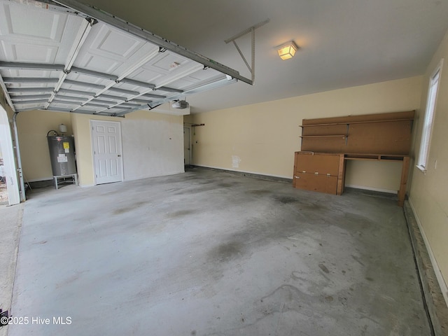 garage with electric water heater and a garage door opener