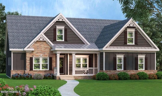 craftsman inspired home with covered porch and a front lawn