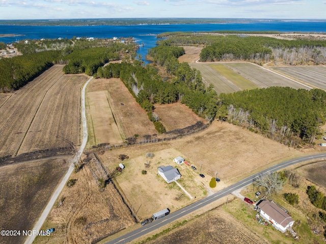 birds eye view of property with a rural view and a water view