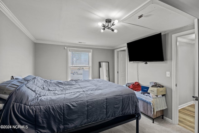 bedroom featuring hardwood / wood-style floors and crown molding