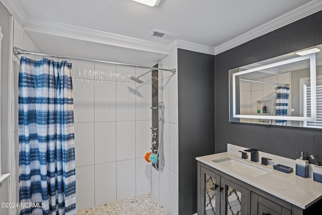 bathroom with crown molding, vanity, and walk in shower