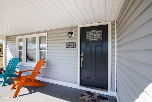 doorway to property with a porch