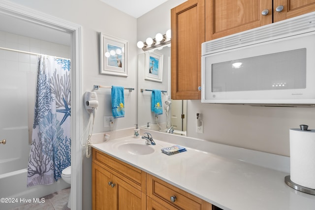 full bathroom featuring tile patterned flooring, vanity, shower / bath combination with curtain, and toilet