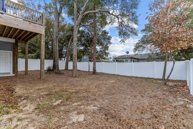 view of yard with a wooden deck