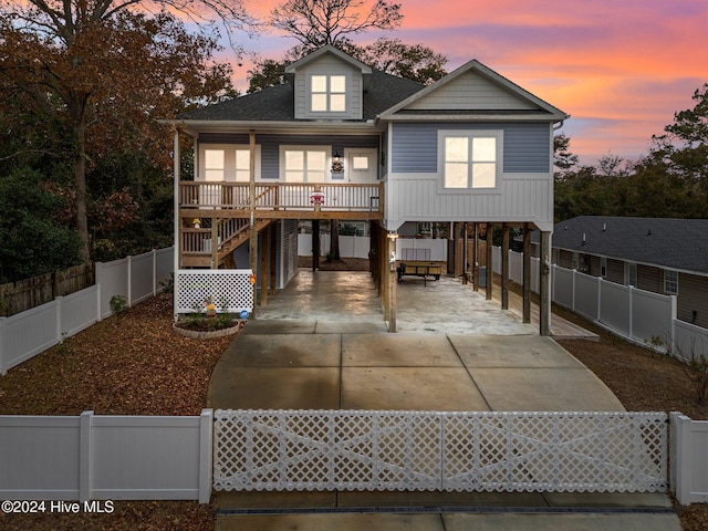 view of front of property featuring a carport