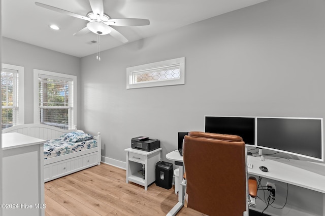 bedroom with ceiling fan and light hardwood / wood-style flooring