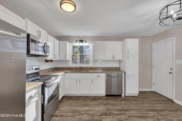 kitchen with white cabinetry, sink, and appliances with stainless steel finishes