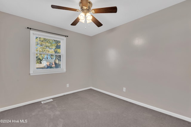 spare room with ceiling fan and carpet floors