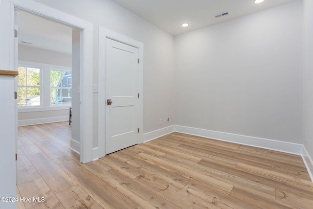 unfurnished room with light hardwood / wood-style floors