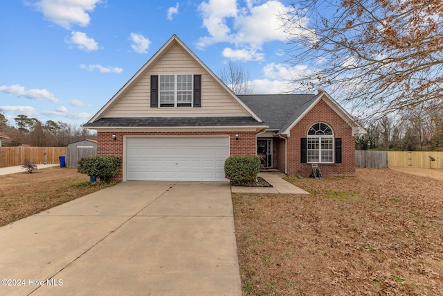 front facade with a garage and a front yard