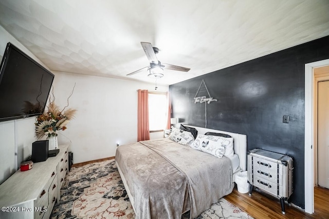 bedroom featuring ceiling fan and hardwood / wood-style floors