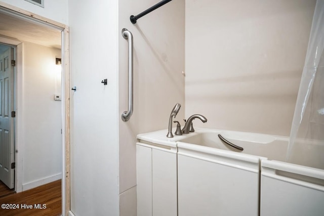 bathroom featuring hardwood / wood-style floors