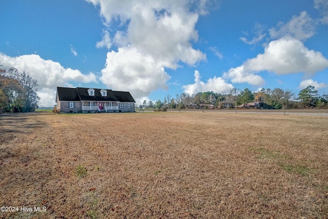 view of yard with a rural view