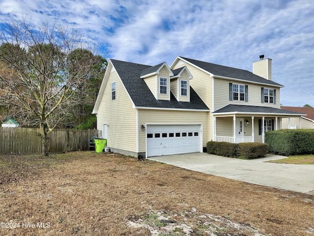 view of front of home featuring covered porch and a garage