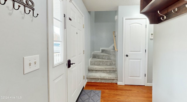 mudroom with light hardwood / wood-style floors