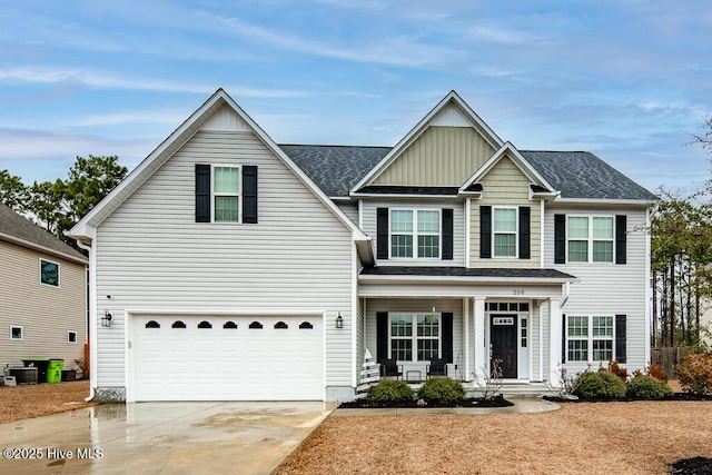 view of front of property with a porch, central AC, and a garage