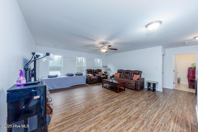 living room with hardwood / wood-style floors and ceiling fan