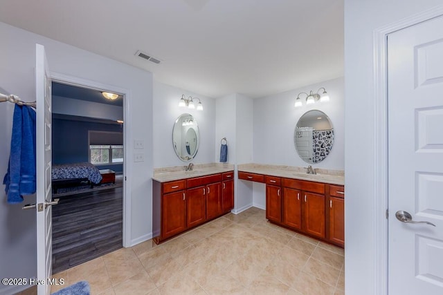 bathroom with vanity and tile patterned floors