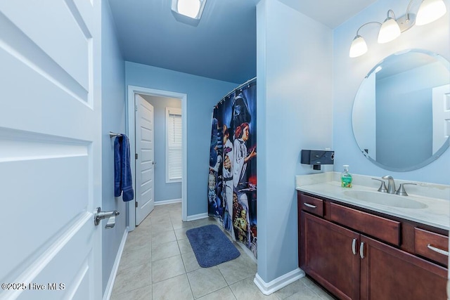 bathroom with tile patterned flooring and vanity