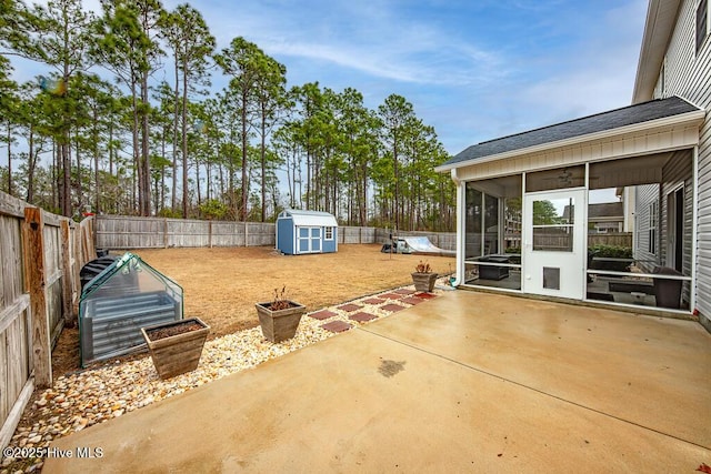 view of patio with a shed and a sunroom