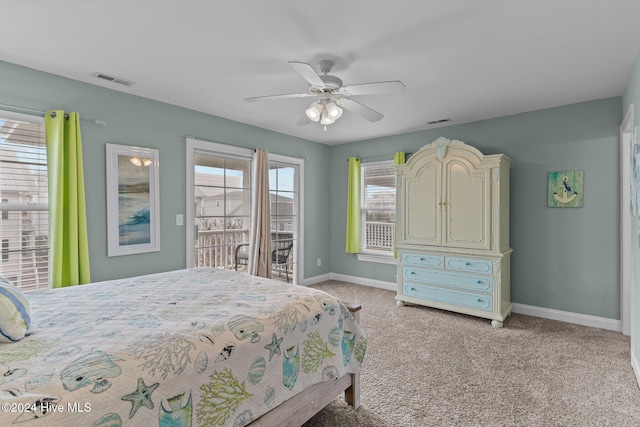 carpeted bedroom with ceiling fan and access to exterior