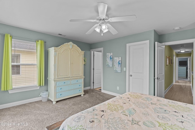 bedroom with ceiling fan and carpet floors