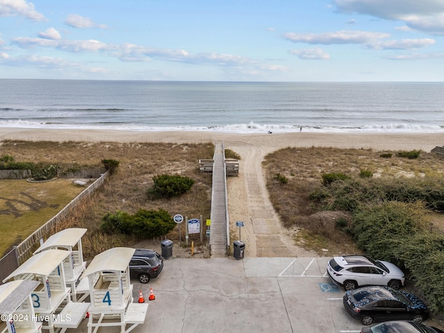 aerial view featuring a water view and a beach view