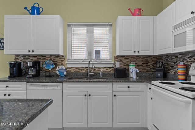 kitchen featuring backsplash, white cabinetry, sink, and white appliances